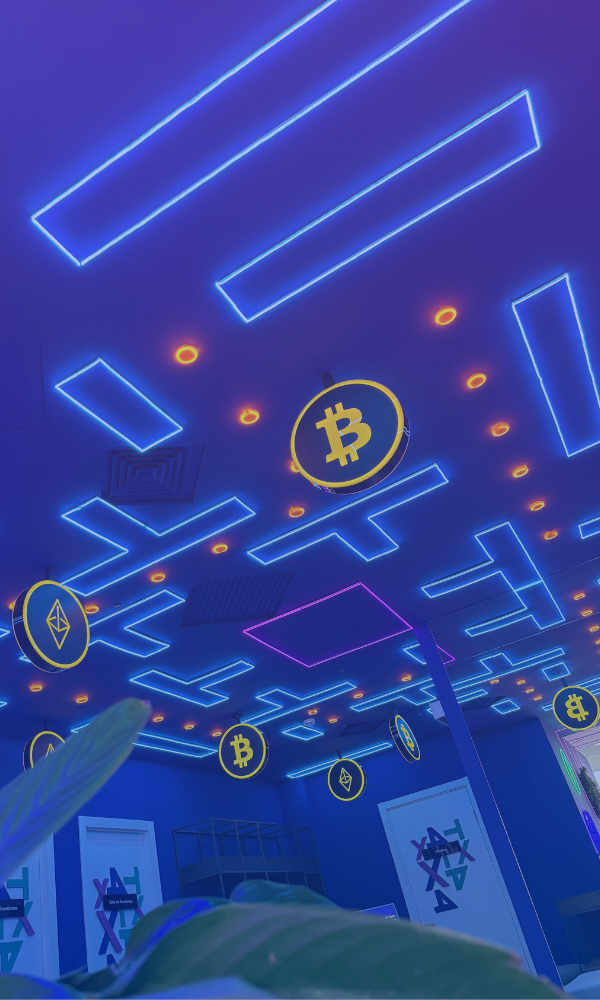 X4T Office in Asunción, Paraguay - Main entrance with modern neon lighting and Bitcoin/Ethereum signage